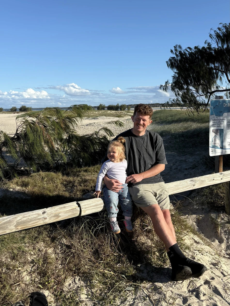 Kevin and his daughter on the beach